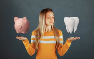 Woman deciding between money or teeth